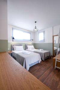 Кровать или кровати в номере AG Luxury Villas, Iraklitsa