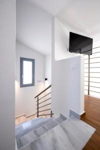 Кровать или кровати в номере AG Luxury Villas, Iraklitsa