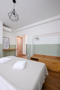 Кровать или кровати в номере AG Luxury Villas, Iraklitsa