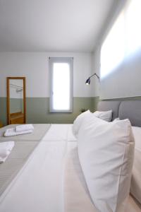 Кровать или кровати в номере AG Luxury Villas, Iraklitsa