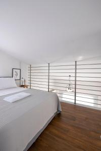 Кровать или кровати в номере AG Luxury Villas, Iraklitsa