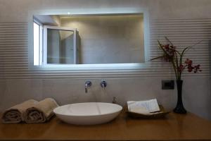 A bathroom at TUSCANY LOFT IN THE CITY