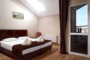 Ein Bett oder Betten in einem Zimmer der Unterkunft Complex Turistic Codru