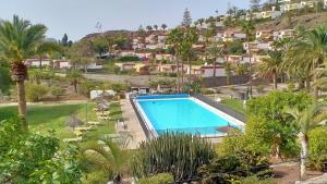 una imagen de una piscina en un complejo en ROCAS ROJAS OCEAN VIEW SAN AGUSTIN, en San Agustín