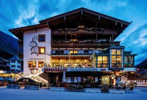 a hotel in the mountains at night at Hotel Neuhintertux in Tux
