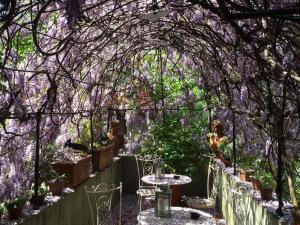 a table with a bunch of flowers in it at Locanda Sant' Agostino in Lucca