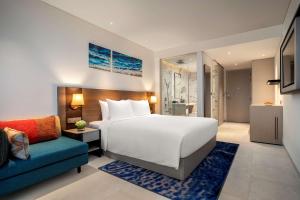 A bed or beds in a room at Radisson Hotel Danang