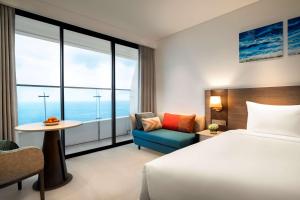 A bed or beds in a room at Radisson Hotel Danang