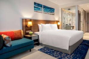 A bed or beds in a room at Radisson Hotel Danang