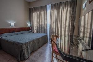 Postel nebo postele na pokoji v ubytování Hotel Petra