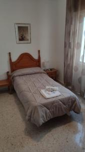 Una cama o camas en una habitación de Hostal Efebo 24H