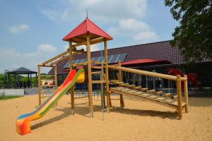 a playground with a slide in the sand at Hotel-Restaurant Rotes Einhorn Düren *** Superior in Düren - Eifel