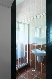 a bathroom with a sink and a mirror at Orhan Kutbayin Evi in Buyukada +31 photos