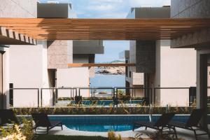 a view from the balcony of a building with a swimming pool at Cabo Villas in Arapya