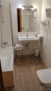 Ett badrum på Hotel Vicente