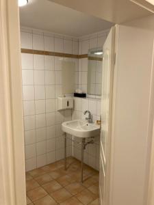 a bathroom with a sink and a mirror at FEWO Königsberg Weingut C A Haussmann in Traben-Trarbach +7 photos