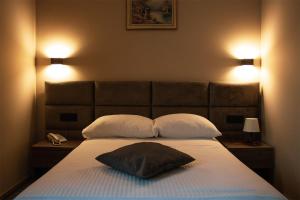 Ένα ή περισσότερα κρεβάτια σε δωμάτιο στο NEW Garni Hotel FILIA