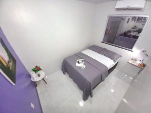 En eller flere senge i et værelse på Casa moderna no centro, ideal para famílias