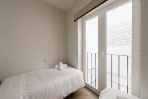 Cama o camas de una habitación en T1, Tirso de Molina, apartamento luminoso y tranquilo