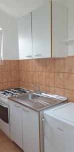 Kuchyň nebo kuchyňský kout v ubytování Apartments Oliva