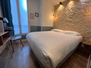 Postel nebo postele na pokoji v ubytování Hôtel Tilde + 29 fotografií