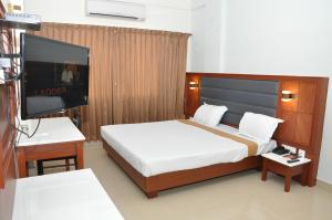 Säng eller sängar i ett rum på Hotel Royal Chambers