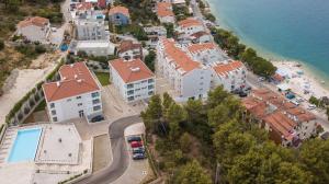 an aerial view of a city with a beach and buildings at Villa Malo More in Trogir