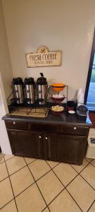 a kitchen counter with pots and pans on it at Red Roof Inn Tifton in Tifton