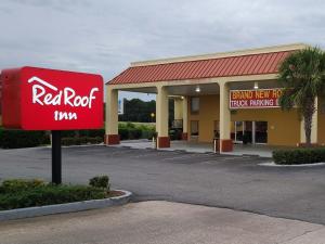 a red sign in front of a red roof inn at Red Roof Inn Tifton in Tifton