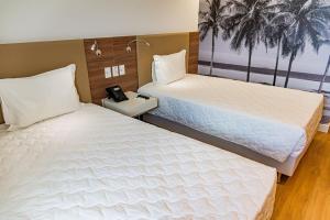Postel nebo postele na pokoji v ubytování Rio Hotel by Bourbon Maringá