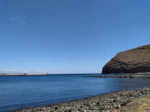 a view of the ocean from a rocky beach at apartamentos la villa 3 in San Sebastián de la Gomera