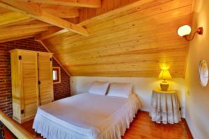 Postel nebo postele na pokoji v ubytování Tranquilla River Lodge