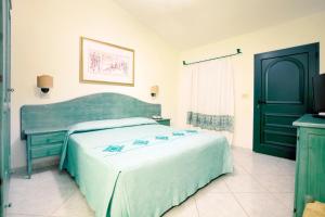 Postel nebo postele na pokoji v ubytování Club Hotel Marina Seada Beach