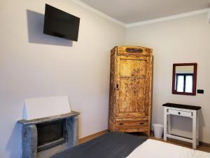 TV a/nebo společenská místnost v ubytování B&B L'orto del Geo