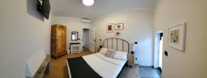 Postel nebo postele na pokoji v ubytování B&B L'orto del Geo