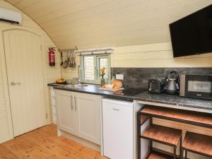 a kitchen with a sink and a counter top at Fox in Keighley