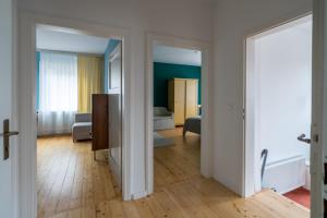 a room with a door open to a living room at 80 Quadratmeter Komfortzone in Braunlage