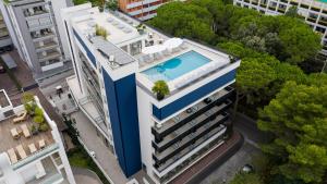 an overhead view of a building with a swimming pool at HOTEL VENICE BEACH HVB 34 Lifestyle 4 Superior in Bibione