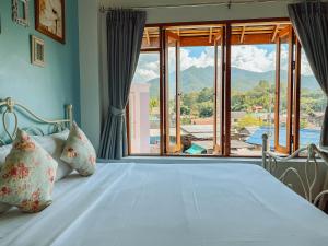 Giường trong phòng chung tại Pai Cherkaew Boutique House +75 ảnh