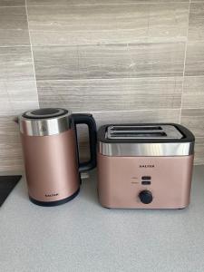 two coffee machines sitting next to each other at LUX Studio Loft in London