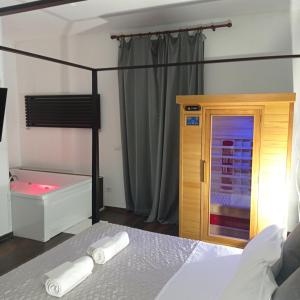 a bedroom with a bed and a bath tub at SUITE 39 in Molfetta