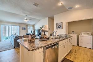 a kitchen with a sink and a counter top at Golfers Paradise - The Villages in Wildwood! in Wildwood