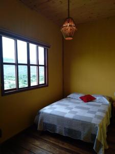 Кровать или кровати в номере Central do Paraíso Lapinha da Serra