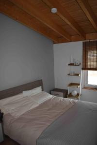 A bed or beds in a room at CASA MARE e TRAMONTO