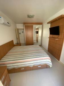 En eller flere senge i et værelse på Costa Maggiore Residencial Resort