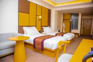 Postel nebo postele na pokoji v ubytování 2000 Hotel Downtown Kigali