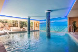 The swimming pool at or close to Lago Garden Apart-Suites & Spa Hotel
