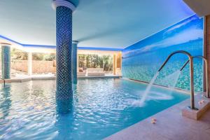 The swimming pool at or close to Lago Garden Apart-Suites & Spa Hotel