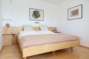 Postel nebo postele na pokoji v ubytování Appartements Kronig