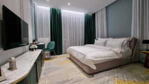 מיטה או מיטות בחדר ב-ARN Boutique Hotel